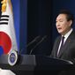 In this photo provided by South Korea Presidential Office, South Korean President Yoon Suk Yeol speaks during the New Year&#39;s address to the nation at the presidential office in Seoul, South Korea, Sunday, Jan. 1, 2023. (South Korea Presidential Office via AP)