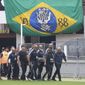 The coffin with the remains of Brazilian soccer great Pele is carried to the Vila Belmiro stadium in Santos, Brazil, Monday, Jan. 2, 2023. (AP Photo/Andre Penner)