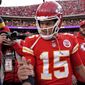 Kansas City Chiefs quarterback Patrick Mahomes (15) and Denver Broncos quarterback Russell Wilson (3) greet each other after an NFL football game Sunday, Jan. 1, 2023, in Kansas City, Mo. (AP Photo/Charlie Riedel) **FILE**