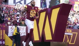 Washington Commanders defensive end Montez Sweat runs onto the field during player introductions before an NFL football game against the Cleveland Browns, Sunday, Jan. 1, 2023, in Landover, Md. (AP Photo/Patrick Semansky)