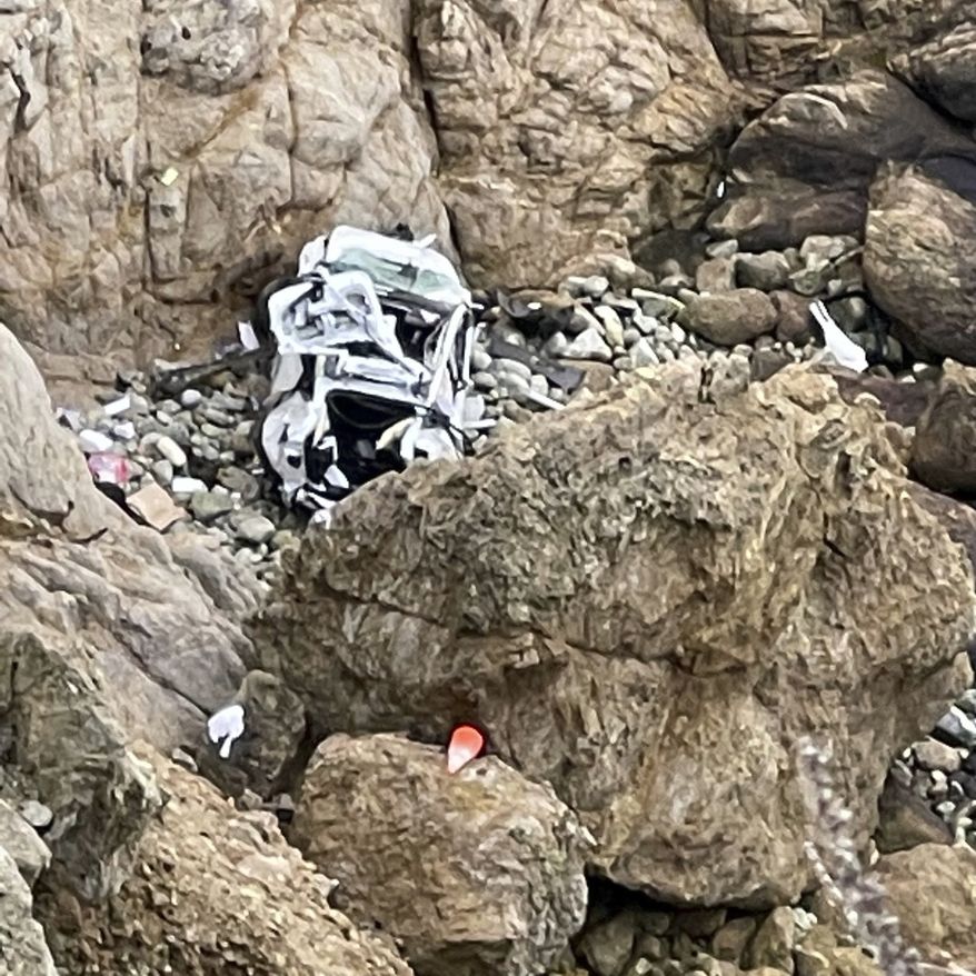 This image from video provided by San Mateo County Sheriff&#x27;s Office shows a Tesla vehicle that plunged off a Northern California cliff along the Pacific Coast Highway, Monday, Jan. 2, 2023, near an area known as Devil&#x27;s Slide, leaving four people in critical condition, a fire official said. The vehicle fell about 250 feet (76.20 meters) from the highway, the fire official said. Motorists were told to expect delays as rescuers worked. Helicopters were expected to transport four people to hospitals. (San Mateo County Sheriff&#x27;s Office via AP)