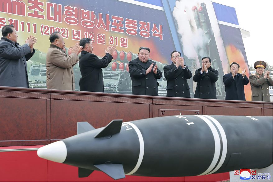 In this photo provided by the North Korean government, North Korean leader Kim Jong-un, center, attends a ceremony of donating 600 mm super-large multiple launch rocket system at a garden of the Workers&#x27; Party of Korea headquarters in Pyongyang, North Korea Saturday, Dec. 31, 2022. Independent journalists were not given access to cover the event depicted in this image distributed by the North Korean government. The content of this image is as provided and cannot be independently verified. Korean language watermark on image as provided by source reads: &quot;KCNA&quot; which is the abbreviation for Korean Central News Agency. (Korean Central News Agency/Korea News Service via AP)