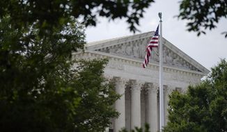 An American flag waves in front of the U.S. Supreme Court building in Washington on June 27, 2022. Supreme Court arguments are continuing long after a red light tells lawyers to stop. Arguments that usually lasted an hour have stretched beyond two this term so on many days it is well past lunchtime before the court breaks. (AP Photo/Patrick Semansky) **FILE**