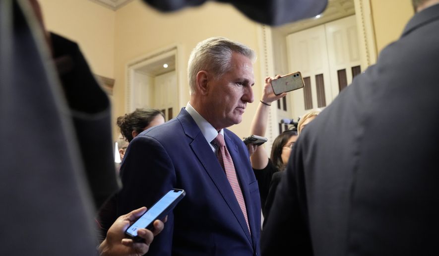 House Republican Leader Kevin McCarthy of Calif., is followed by reporters as he heads to the House Floor on Capitol Hill in Washington, Tuesday, Jan. 3, 2023. (AP Photo/Susan Walsh)