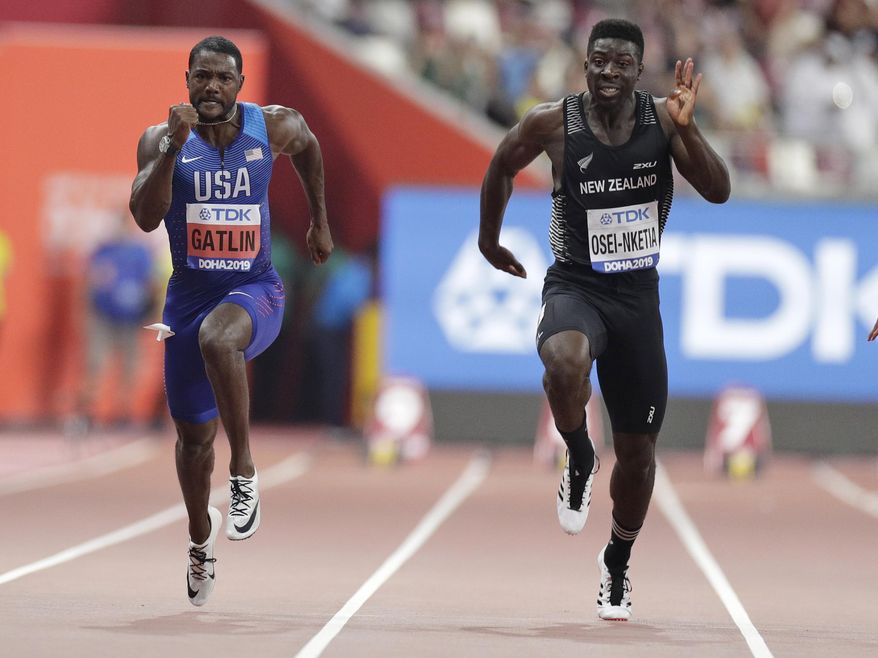 New Zealand&#x27;s Edward Osei-Nketia, right, and Justin Gatlin of the United States compete during the men&#x27;s 100 meters heat at the World Athletics Championships in Doha, Qatar, Sept. 27, 2019. The fastest man in New Zealand is ready to try college football. Eddie Osei-Nketia holds his country&#x27;s 100-meter record and has some rugby experience. He has signed to play for Hawaii and is among a geographically diverse group of international recruits who will suit up on campuses across the United States. (AP Photo/Petr David Josek, File) **FILE**