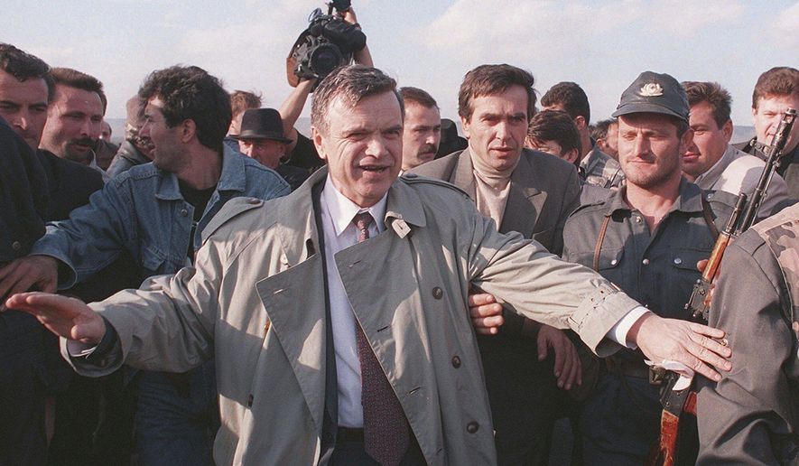 The former speaker of Russia&#x27;s parliament Ruslan Khasbulatov makes his way through a crowd of people, on his way to Grozny airport, Sept. 29, 1995. Ruslan Khasbulatov, who led a rebellion against Russia&#x27;s first post-Soviet president, has died. He was 80. Khasbulatov&#x27;s death was reported Tuesday Jan. 3, 2023, by Russian state television. (AP Photo/File)