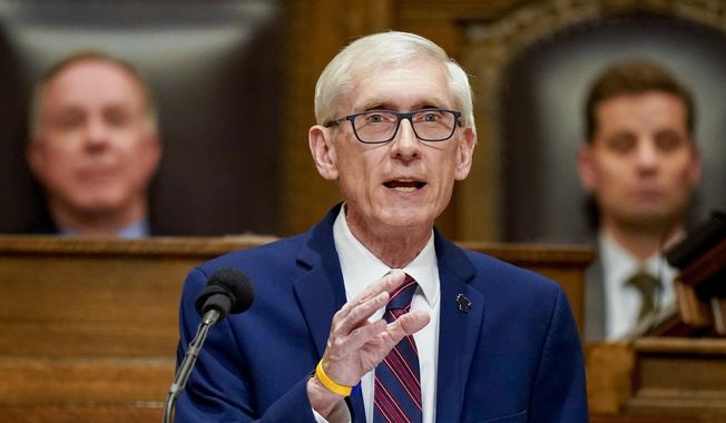 Wisconsin Gov. Tony Evers addresses a joint session of the state Legislature in the Assembly chambers during the governor&#x27;s State of the State speech at the state Capitol in Madison, Wis., Feb. 15, 2022. Evers is slated to be sworn into office for a second term Tuesday, Jan. 3, 2023, where he will once again face a Republican-controlled legislature just as he did that past four years. (AP Photo/Andy Manis, File)