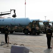 Chinese military vehicles carrying JL-2 submarine-launched missiles roll during a parade to commemorate the 70th anniversary of the founding of Communist China in Beijing, Tuesday, Oct. 1, 2019. Trucks carrying weapons including a nuclear-armed missile designed to evade U.S. defenses rumbled through Beijing as the Communist Party celebrated its 70th anniversary in power with a parade Tuesday that showcased China&#x27;s ambition as a rising global force. (AP Photo/Mark Schiefelbein)