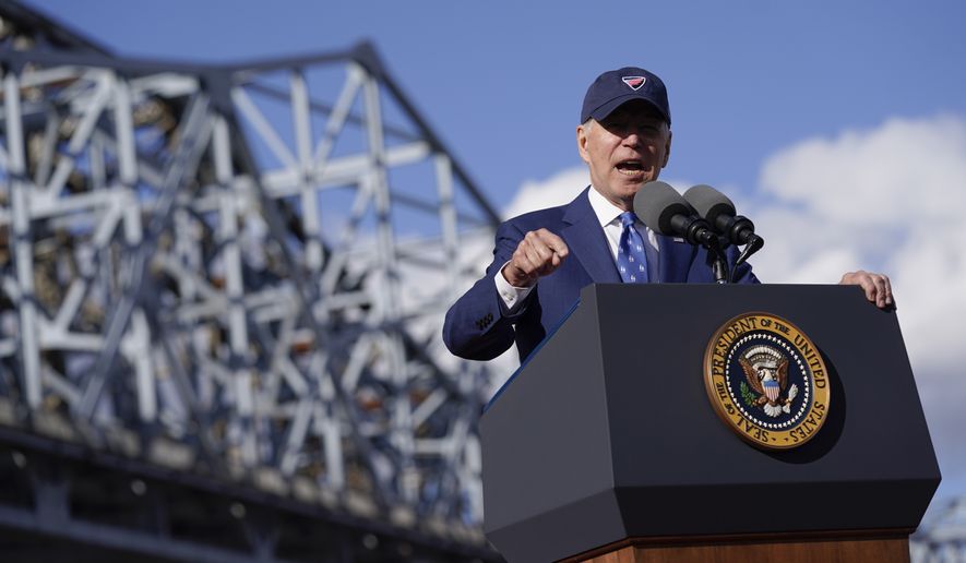 President Joe Biden speaks about his infrastructure agenda under the Clay Wade Bailey Bridge, Wednesday, Jan. 4, 2023, in Covington, Ky. (AP Photo/Patrick Semansky)
