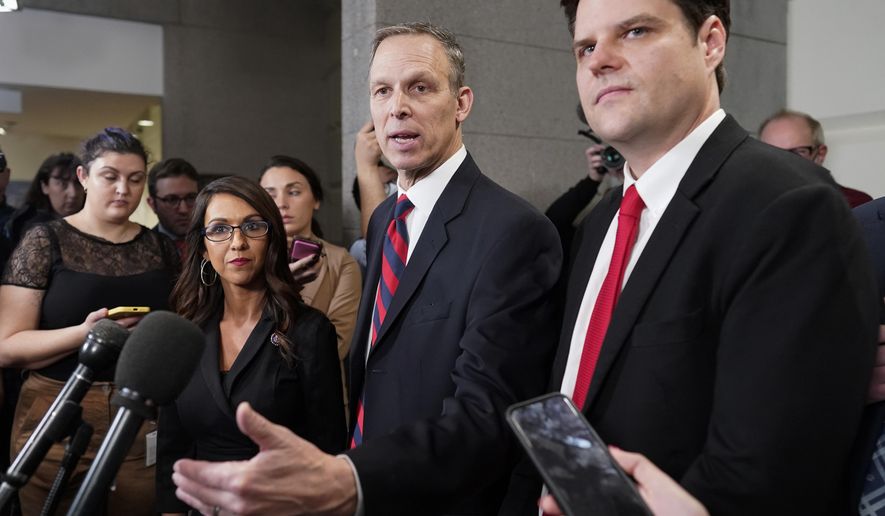 Rep. Scott Perry, R-Pa., speaks at the Capitol in Washington, Tuesday, Jan. 3, 2023, on the opening day of the 118th Congress, as Rep. Matt Gaetz, R-Fla., right, and Rep. Lauren Boebert, R-Colo., listen. All three are members of the Freedom Caucus and oppose Rep. Kevin McCarthy, R-Calif., as the new House Speaker. (AP Photo/J. Scott Applewhite)