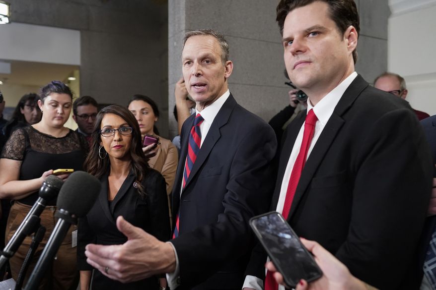 Rep. Scott Perry, R-Pa., speaks at the Capitol in Washington, Tuesday, Jan. 3, 2023, on the opening day of the 118th Congress, as Rep. Matt Gaetz, R-Fla., right, and Rep. Lauren Boebert, R-Colo., listen. All three are members of the Freedom Caucus and oppose Rep. Kevin McCarthy, R-Calif., as the new House Speaker. (AP Photo/J. Scott Applewhite)