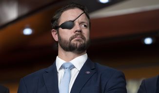 Rep. Dan Crenshaw, R-Texas, attends a news conference with Republicans, mainly veterans and medical professionals, who support Rep. Kevin McCarthy, R-Calif., for Speaker of the House, Wednesday, Jan. 4, 2023, on Capitol Hill in Washington. (AP Photo/Jacquelyn Martin)