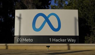 Meta&#39;s logo can be seen on a sign at the company&#39;s headquarters in Menlo Park, Calif., on Nov. 9, 2022. Irish regulators on Wednesday Jan. 4, 2023 hit Facebook parent Meta with hundreds of millions in fines and banned the company from forcing European users to agree to seeing personalized ads based on their online activity. (AP Photo/Godofredo A. Vásquez, File)