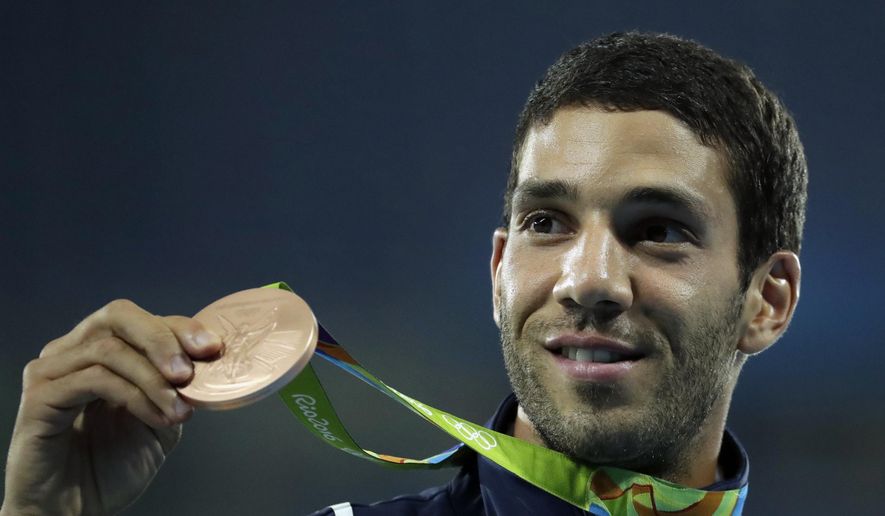 France&#39;s Mahiedine Mekhissi with his bronze medal after the award ceremony for the men&#39;s 3000-meter steeplechase during the athletics competitions of the 2016 Summer Olympics at the Olympic stadium in Rio de Janeiro, Brazil, Wednesday, Aug. 17, 2016. (AP Photo/Charlie Riedel, File)