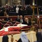 The body of late Pope Emeritus Benedict XVI is lied out in state inside St. Peter&#39;s Basilica at The Vatican, Wednesday, Jan. 4, 2023. Pope Benedict, the German theologian who will be remembered as the first pope in 600 years to resign, has died, the Vatican announced Saturday, Dec. 31, 2022. He was 95.(AP Photo/Ben Curtis)