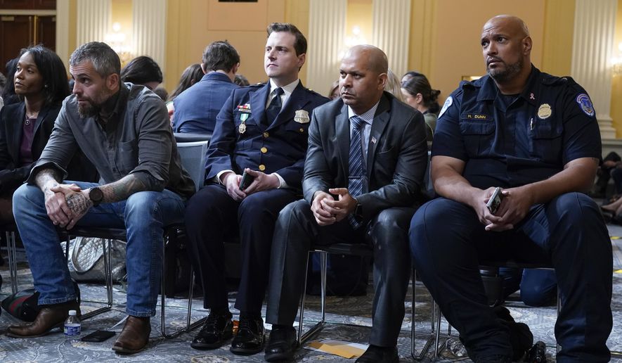 From left, Serena Liebengood, widow of U.S. Capitol Police officer Howie Liebengood, former Washington Metropolitan Police Department officer Michael Fanone, Washington Metropolitan Police Department officer Daniel Hodges, U.S. Capitol Police Sgt. Aquilino Gonell and U.S. Capitol Police Sgt. Harry Dunn listen as the House select committee investigating the Jan. 6 attack on the U.S. Capitol holds a hearing on Capitol Hill in Washington, Oct. 13, 2022. (AP Photo/Jacquelyn Martin) **FILE**