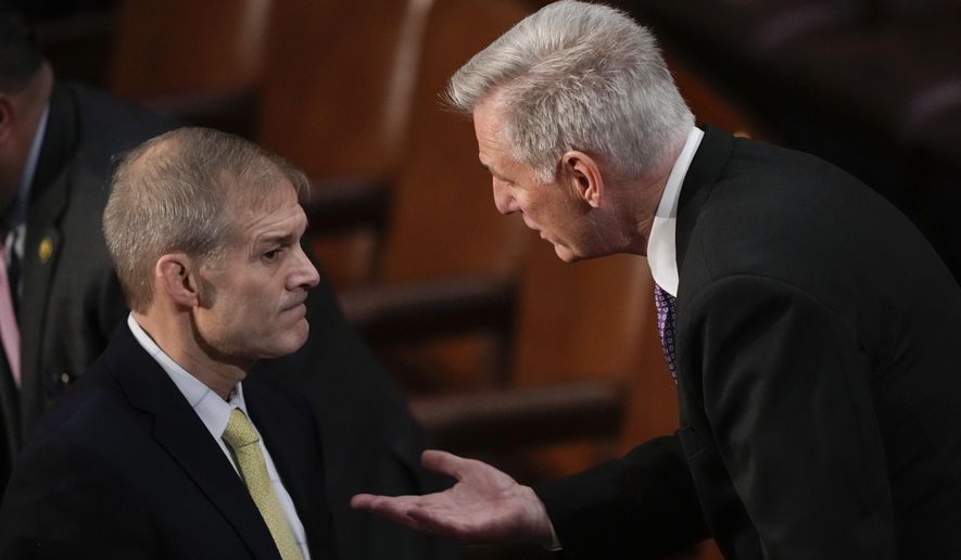 Rep. Jim Jordan, R-Ohio, talks with Rep. Kevin McCarthy, R-Calif., in the House chamber as the House meets for a second day to elect a speaker and convene the 118th Congress in Washington, Wednesday, Jan. 4, 2023. (AP Photo/Andrew Harnik)