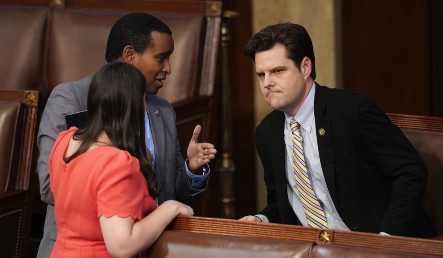 Rep. Joe Neguse, D-Colo., left, talks with Rep. Matt Gaetz, R-Fla., during the eleventh vote in the House chamber as the House meets for the third day to elect a speaker and convene the 118th Congress in Washington, Thursday, Jan. 5, 2023. (AP Photo/Alex Brandon)