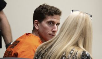 Bryan Kohberger, left, who is accused of killing four University of Idaho students in November 2022, looks toward his attorney, public defender Anne Taylor, right, during a hearing in Latah County District Court, Thursday, Jan. 5, 2023, in Moscow, Idaho. (AP Photo/Ted S. Warren, Pool)