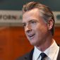 California Gov. Gavin Newsom talks to reporters after voting in Sacramento, Calif., Nov. 8, 2022. Newsom will be inaugurated for his second and final term Friday, Jan. 6. He chose the date to stand in contrast to the insurrection at the U.S. Capitol on Jan. 6, 2021. (AP Photo/Rich Pedroncelli, File)