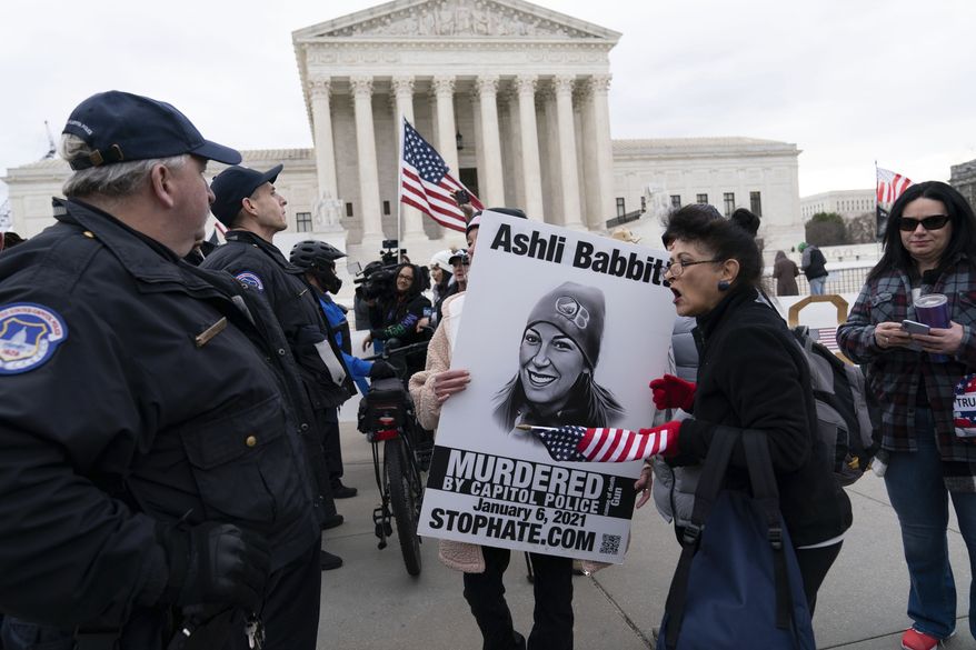 Supporters of former President Donald Trump protest outside of the Supreme Court on the second anniversary of the Jan. 6, assault on the U.S. Capitol, in Washington, Friday, Jan. 6, 2023. (AP Photo/Jose Luis Magana)