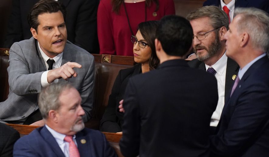 Rep. Matt Gaetz, R-Fla., talks to Rep. Kevin McCarthy, R-Calif., after Gaetz voted &quot;present&quot; in the House chamber as the House meets for the fourth day to elect a speaker and convene the 118th Congress in Washington, Friday, Jan. 6, 2023. (AP Photo/Alex Brandon)