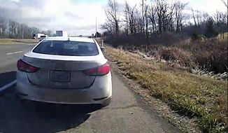 In this image from a bodycam video provided by the Hancock County Sheriff&#x27;s Office, a white Hyundai Elantra occupied by Bryan Kohberger and his father is seen on a deputy’s body camera video during a traffic stop on Thursday, Dec. 15, 2022, in Hancock County, Ind. Bryan Kohberger, accused in the November slayings of four University of Idaho students, had a first court appearance on Jan. 5, 2023 in Latah County Court in Moscow, Idaho on first-degree murder charges. (Hancock County Sheriff&#x27;s Office via AP)