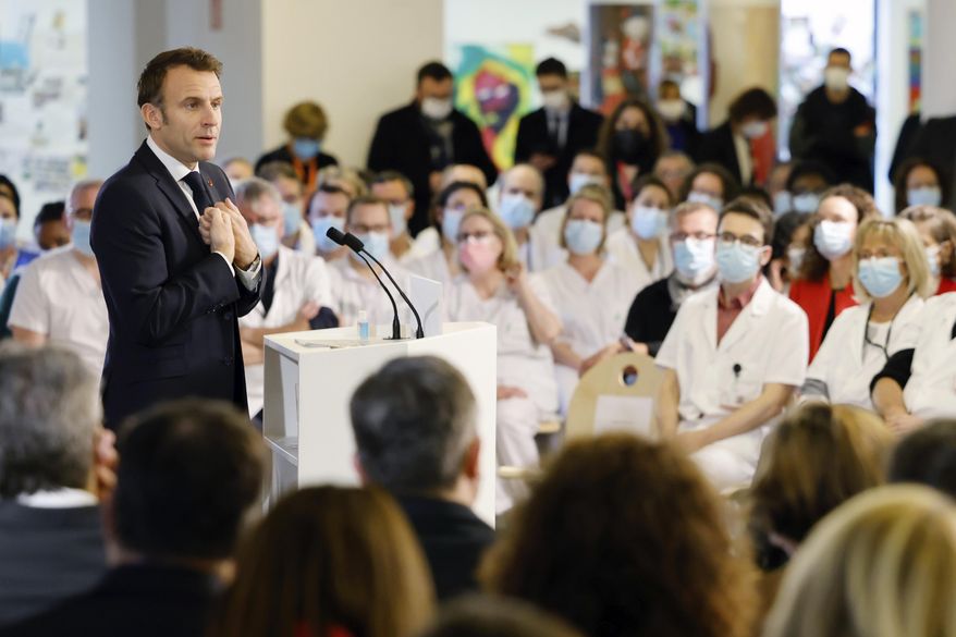 French President Emmanuel Macron delivers his New Year speech to medical workers at the Centre Hospitalier Sud Francilien Hospital in the southern Paris suburban city of Corbeil-Essonnes, Friday Jan. 6, 2023. Emmanuel Macron visits a pediatric hospital and gives a new year&#x27;s speech to medics, amid protests and anger over long-unresolved funding and hiring issues in France&#x27;s health care system.( Ludovic Marin, Pool via AP)
