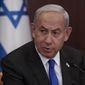 Israeli Prime Minister Benjamin Netanyahu attends the weekly cabinet meeting, Tuesday, Jan. 3, 2023, in Jerusalem. (Atef Safadi/Pool Photo via AP)