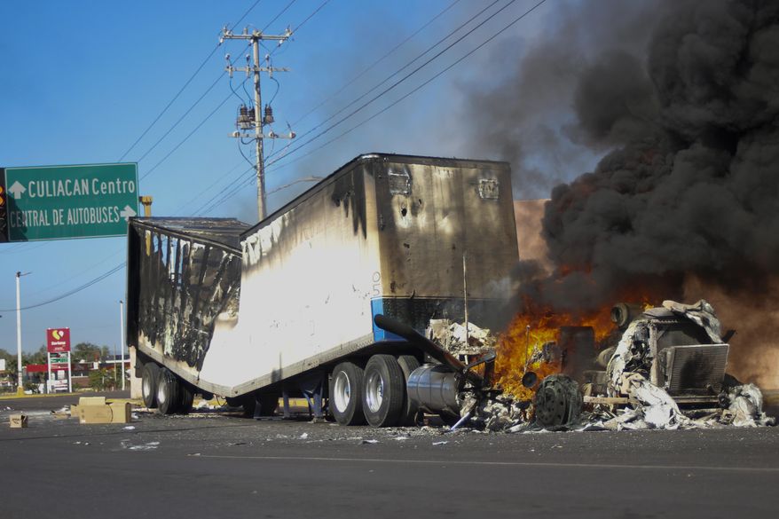 A truck burns on a street in Culiacan, Sinaloa state, Thursday, Jan. 5, 2023. Mexican security forces captured Ovidio Guzmán, an alleged drug trafficker wanted by the United States and one of the sons of former Sinaloa cartel boss Joaquín “El Chapo” Guzmán, in a pre-dawn operation Thursday that set off gunfights and roadblocks across the western state’s capital. (AP Photo/Martin Urista) **FILE**