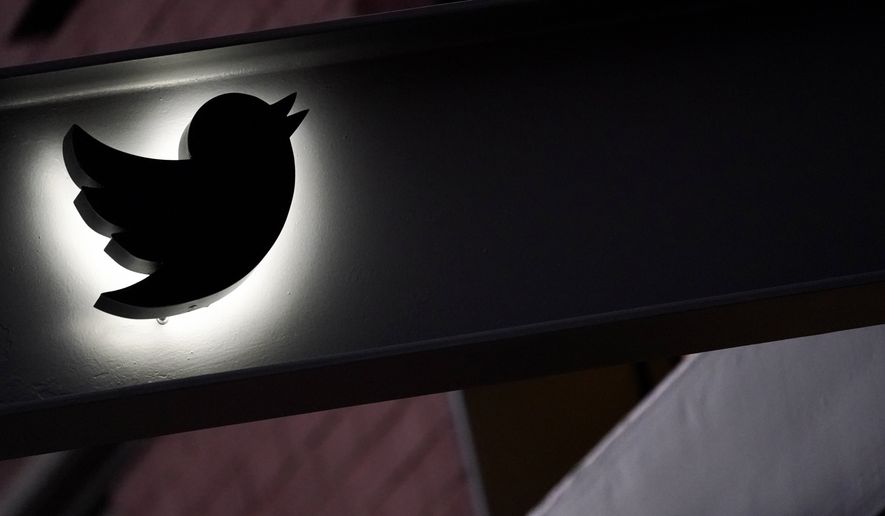 The Twitter logo is seen on the awning of the building that houses the Twitter office in New York, Wednesday, Oct. 26, 2022. (AP Photo/Mary Altaffer, File)