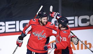 Washington Capitals right wing Tom Wilson (43) celebrates his second goal of the game with teammate Nicklas Backstrom (19) during the second period of an NHL hockey game against the New York Rangers on March 28, 2021, in Washington. The Capitals say Backstrom and Wilson are ready to play. The team said Saturday, Jan. 7, 2023, that the pair are being activated off injured reserve to make their respective season debuts. (AP Photo/Nick Wass, File)
