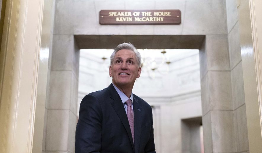 House Speaker Kevin McCarthy of Calif., stands by the newly installed nameplate at his office after he was sworn in as speaker of the 118th Congress in Washington, early Saturday, Jan. 7, 2023. (AP Photo/Jose Luis Magana)