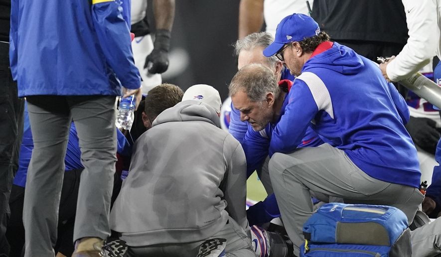Buffalo Bills&#x27; Damar Hamlin is examined during the first half of an NFL football game against the Cincinnati Bengals, Monday, Jan. 2, 2023, in Cincinnati. Quick on-the-field emergency care from well-rehearsed medical personnel is widely credited with helping save Damar Hamlin’s life. But whether his cardiac arrest could have been prevented is much less certain. (AP Photo/Joshua A. Bickel, File)