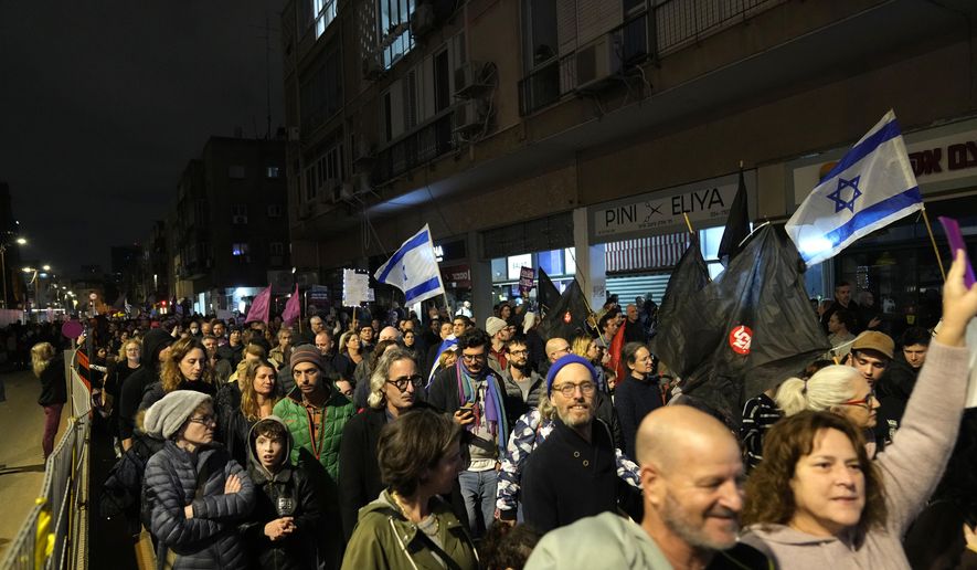 Protesters march in Tel Aviv, Israel, against Prime Minister Benjamin Netanyahu's far-right government, Saturday, Jan. 7, 2023. (AP Photo/ Tsafrir Abayov)