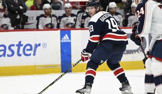 Washington Capitals center Nicklas Backstrom (19) plays during the first period of an NHL hockey game against the Columbus Blue Jackets, Sunday, Jan. 8, 2023, in Washington. (AP Photo/Terrance Williams)
