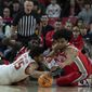 Maryland&#x27;s Patrick Emilien (15) fights for the ball with Ohio State&#x27;s Justice Sueing, right, during the first half of an NCAA college basketball game, Sunday, Jan. 8, 2023, in College Park, Md. (AP Photo/Jose Luis Magana)