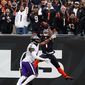 Cincinnati Bengals wide receiver Ja&#39;Marr Chase (1) makes a catch over Baltimore Ravens cornerback Daryl Worley (41) for a touchdown in the first half of an NFL football game in Cincinnati, Sunday, Jan. 8, 2023. (AP Photo/Jeff Dean)