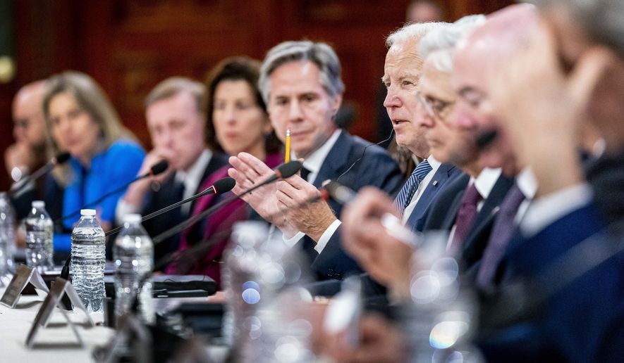 President Joe Biden, accompanied by Secretary of State Antony Blinken, center left, speaks during a meeting with Mexican President Andres Manuel Lopez Obrador at the National Palace in Mexico City, Mexico, Monday, Jan. 9, 2023. (AP Photo/Andrew Harnik)