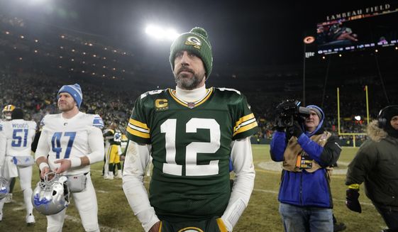 Green Bay Packers quarterback Aaron Rodgers stands on the field following an NFL football game against the Detroit Lions Sunday, Jan. 8, 2023, in Green Bay, Wis. The Lions won 20-16. (AP Photo/Morry Gash)