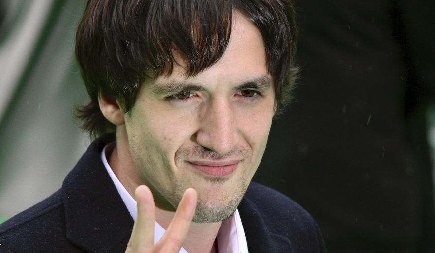 Artur Smolyaninov, a prominent Russian film and theater actor, gestures as he arrives at the opening ceremony of the 31st Moscow International Film Festival in Moscow, Friday, June 19, 2009. Russian authorities have announced criminal probes against a famous actor critical of the war in Ukraine and a philanthropist who supports the Russian opposition. Smolyaninov left the country after Moscow's forces invaded Ukraine and repeatedly spoke out against the war. (AP Photo)