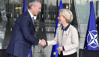 NATO Secretary General Jens Stoltenberg, left, shakes hands with European Commission President Ursula von der Leyen following the signing a Joint Declaration on NATO-EU Cooperation at NATO headquarters in Brussels, Tuesday, Jan. 10, 2023. (John Thys, Pool Photo via AP)