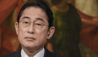 Japanese Prime Minister Fumio Kishida looks on during a joint press statement with Italian Premier Giorgia Meloni at the end of their meeting they held at Chigi Palace government office, Tuesday, Jan. 10, 2023. Kishida is in Italy as part of a five-nation tour abroad. (AP Photo/Andrew Medichini)
