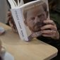 A customer reads a copy of the new book by Prince Harry called &quot;Spare&quot; at a book store in Rome, Tuesday, Jan. 10, 2023. Prince Harry&#x27;s memoir &quot;Spare&quot; arrives in bookstores on Tuesday, providing a varied portrait of the Duke of Sussex and the royal family. (AP Photo/Andrew Medichini)