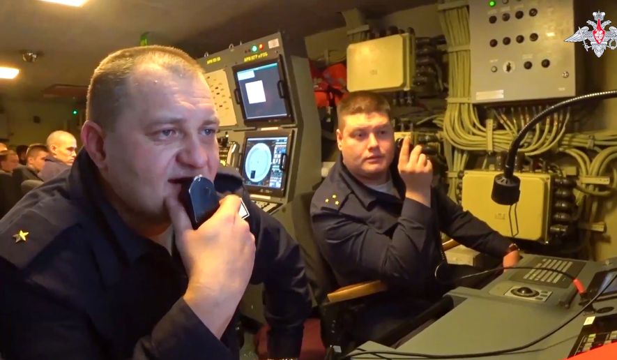 In this handout photo taken from video released by Russian Defense Ministry Press Service on Tuesday, Jan. 10, 2023, Officers are on duty in the control room of the Admiral Gorshkov frigate of the Russian navy. Admiral Gorshkov, which is armed with the top-of-the-line Zircon hypersonic missiles, set off on a trans-ocean cruise last week. (Russian Defense Ministry Press Service via AP)