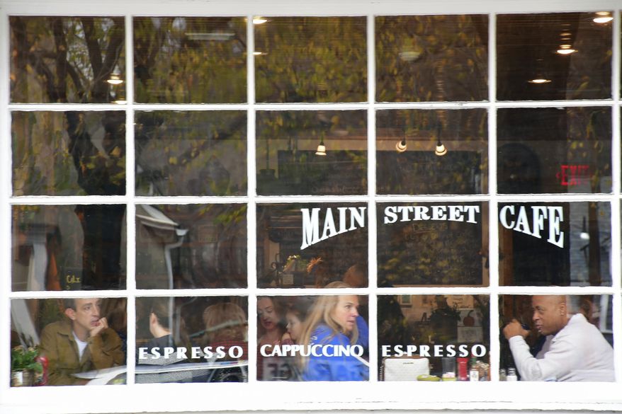 Diners are seen through the window of The Main Street Cafe in downtown Stockbridge, Mass., Sunday, Nov. 13, 2022. Small businesses face a mix of old and new challenges as 2023 begins. A looming recession, still high (although easing) inflation and labor woes are a few things small businesses will have to tackle. (Gillian Jones/The Berkshire Eagle via AP) **FILE**