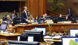 In this March 7, 2017 photo, Hawaii state Rep. Gene Ward talks about why he&#39;s against a bill to require presidential candidates to disclose tax returns before a vote in Honolulu. Similar bills were introduced in more than 20 states, and Hawaii and New Jersey recently became the first states in which the bills passed out of legislative chambers. Some legal scholars question the constitutionality of states setting restrictions on presidential candidates, saying that is left to the US Constitution. (AP Photo/Cathy Bussewitz)