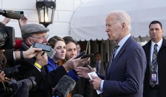 President Joe Biden talks with reporters before he and first lady Jill Biden board Marine One on the South Lawn of the White House in Washington, Wednesday, Jan. 11, 2023. (AP Photo/Susan Walsh)
