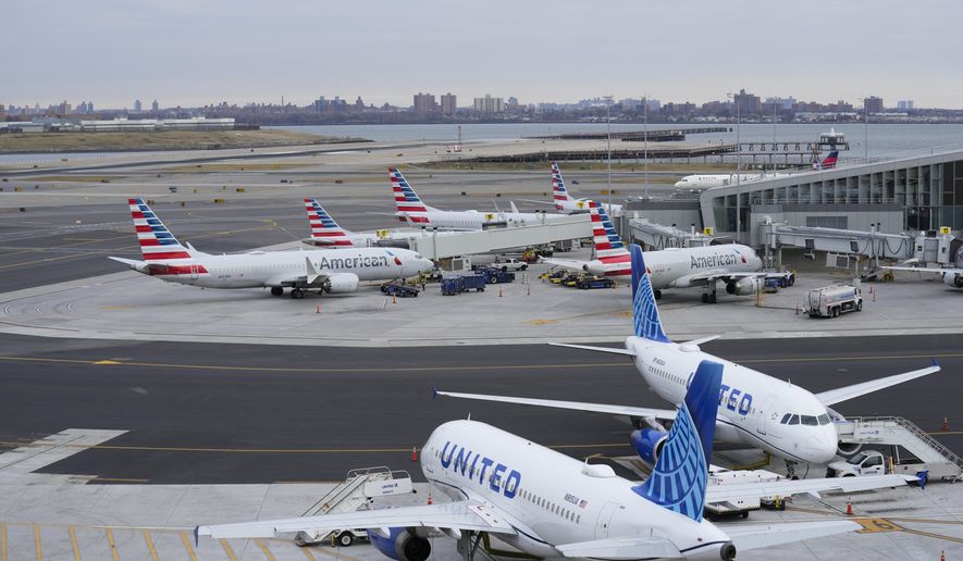 Planes sit on the tarmac at Terminal B at LaGuardia Airport in New York, Wednesday, Jan. 11, 2023. The Federal Aviation Administration is lifting a ground stop on flights across the U.S. following a computer outage early Wednesday that resulted in thousands of delays and hundreds of cancellations quickly cascading through the system at airports nationwide. (AP Photo/Seth Wenig)