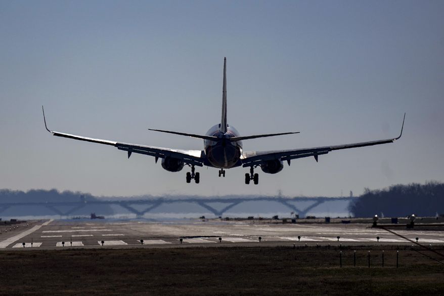 A Southwest plane lands at Ronald Reagan Washington National Airport in Arlington, Va., Friday, Dec. 30, 2022. A computer outage at the Federal Aviation Administration brought flights to a standstill across the U.S. on Wednesday, with hundreds of delays quickly cascading through the system at airports nationwide. (AP Photo/Carolyn Kaster, File)